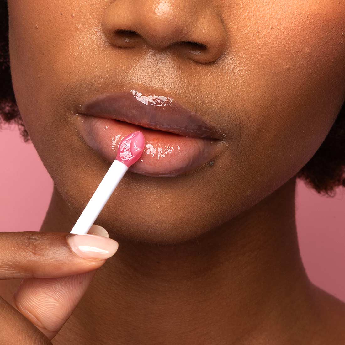 Model applying Lip Mask with silicone spatula