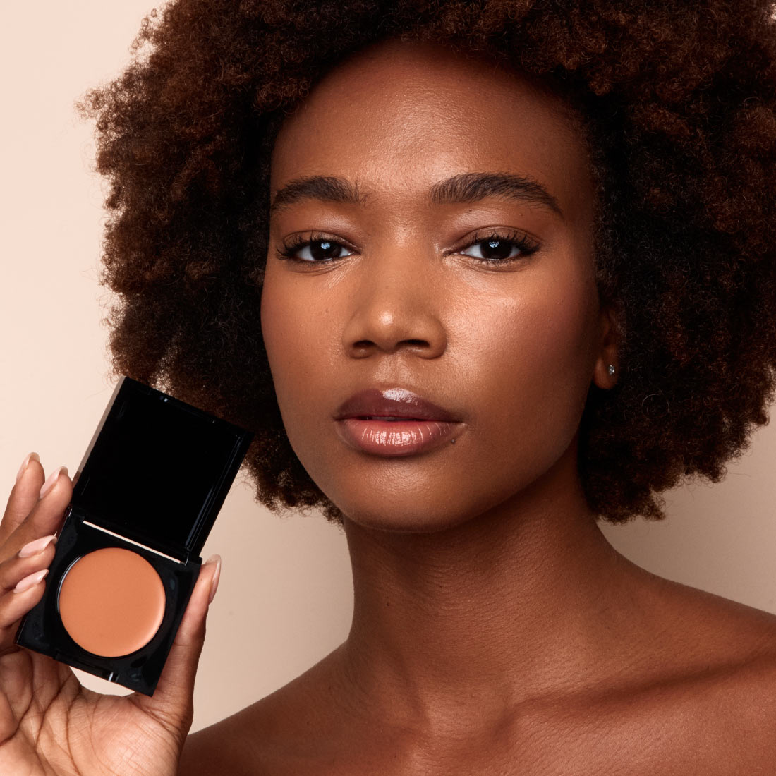 Palladio Under Eye Brightener in Golden Tan shade shown on deep skin to even under-eye tone