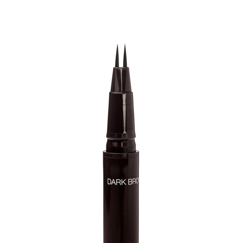 Close-up of the uncapped Palladio Brow Ink Micro Brow Pen in Dark Brown, showing the fine dual-precision brush tip and the "Dark Brown" shade label on the barrel.