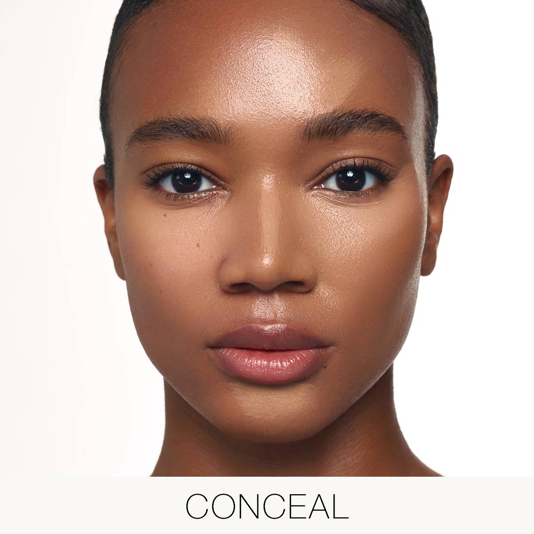 Model wearing Palladio Multi Face Palette in Tan-to-Dark with concealer shades applied to brighten and perfect the complexion.