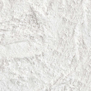 Close-up texture swatch of Palladio 4Ever + Ever Mattifying Loose Setting Powder showing fine white translucent powder texture