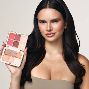 Model holding the open Palladio Multi Face Palette MFP01 Light to Medium to show the complexion and color shades.