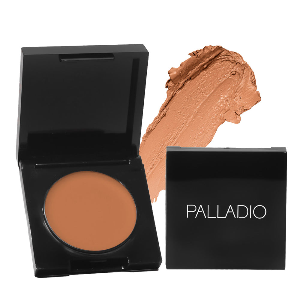 Palladio Under Eye Brightener compact in shade Golden Tan with cream texture swatch.